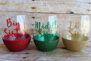 red, green gold big sister middle sister little sister on stemless wine glasses