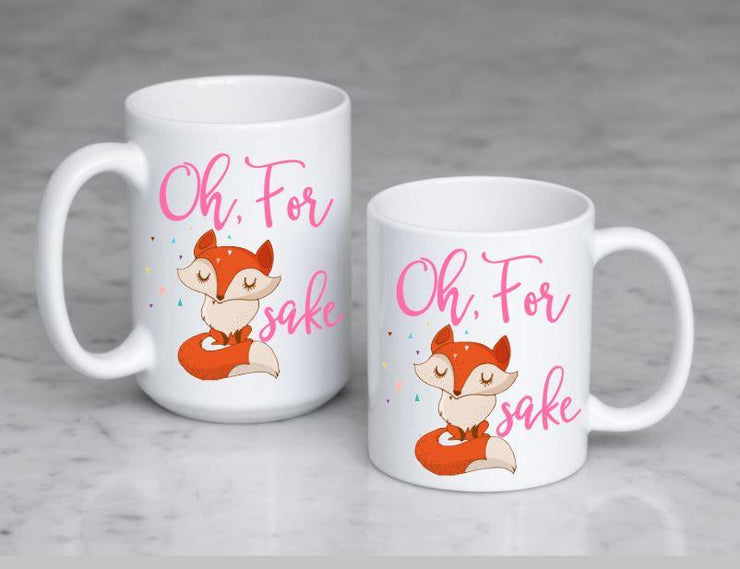 Oh, for fox sake in pink text featuring a orange and tan fox with sassy folded arms and eyes closed showing 2 size mugs side by side