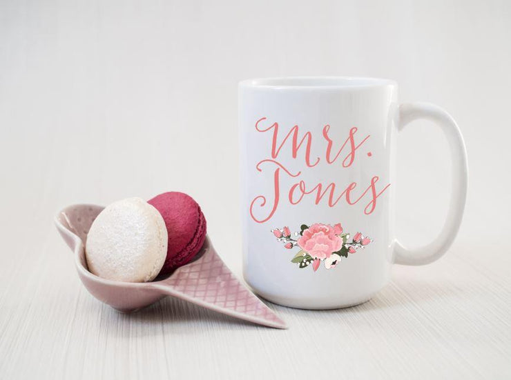 Mrs. Jones custom coffee mug with last name and pink floral below name