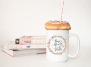 love never fails corinthians 13:8 quote in peach or olive with peach and olive floral wreath on ceramic mug straight on pic with donut and books 